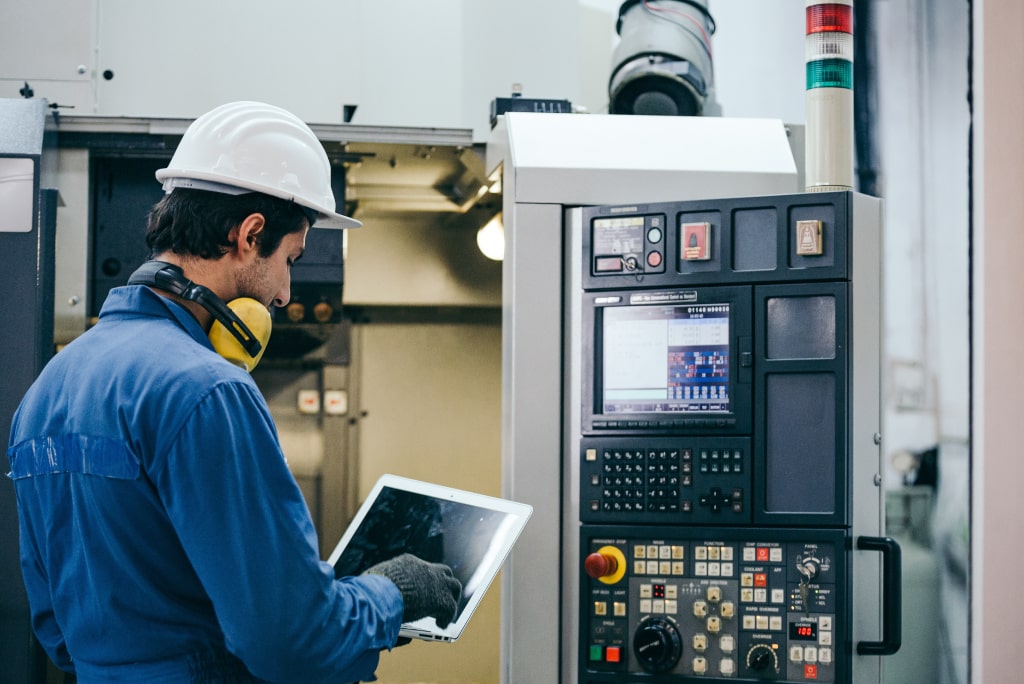 Voltix Controls engineer working on industrial control panel